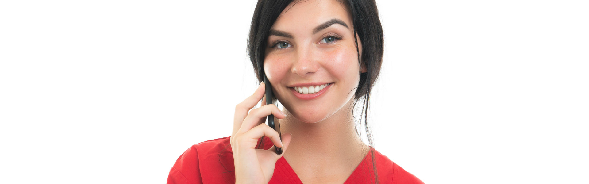 nurse smiling while having a phone call