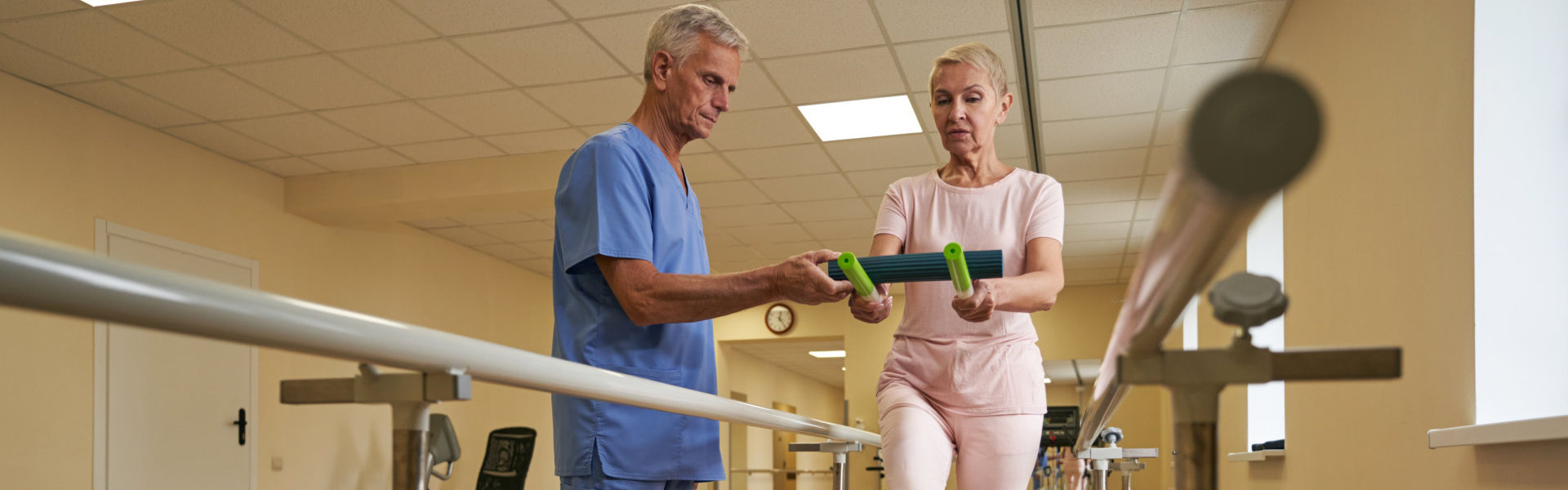 staff helping patient for balance exercising